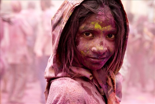 Children are always happy with colors. She came out of the crowd and looked straight at me. Holi festival in Pushkar, India. 