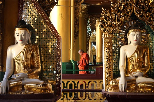 Amidst tradition at Shwedagon Paya, a buddhist monk embraces technology.