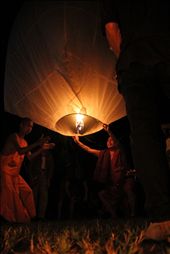 Finally time to let the lantern go, the main monk lets go of the Loi Krathong lantern as the second monk claps along to a chant.: by emilymcmanus, Views[479]