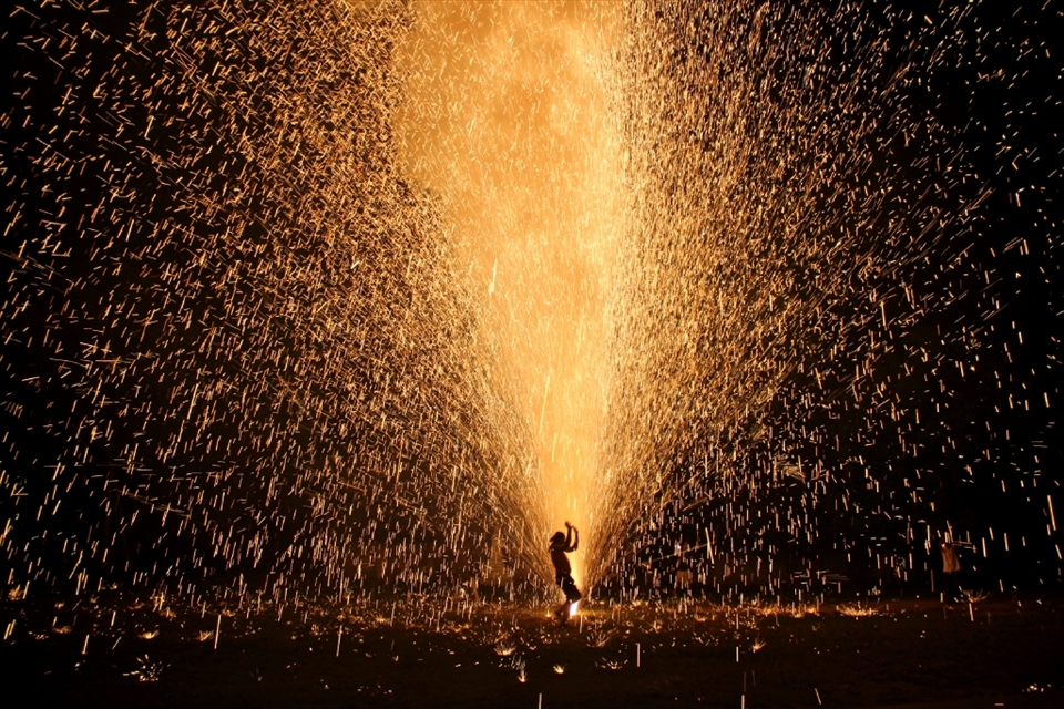 Each year for Loi Krathong, the village makes homemade fireworks and sets them off. This shot captures the joy of the people and the magic of the light. 
