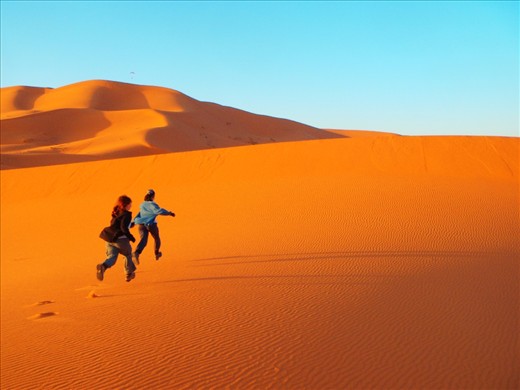 Exuberance at the beauty of the renewed landscape at sunrise in the Sahara. The night winds remove blemishes from the previous day.