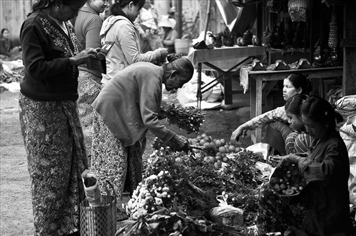 MARKET SCENE: Untouched by major commercialism there are no supermarkets in Nyaung Shwe (Myanmar). An early morning market scene involves street vendors and their customers.