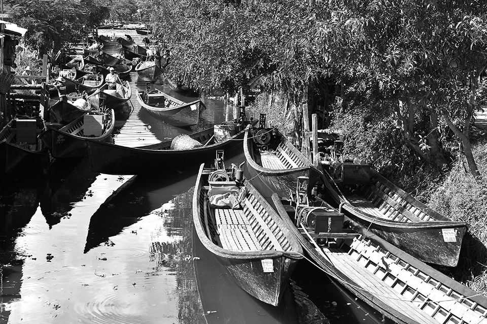 CANAL OF LIFE:  Using small boat as mode of transportation this canal leads to Inle Lake: a very important lake serving the whole township of Nyaung Shwe. Villagers also use this canal to exchange goods/products with others.