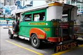 The iconic jeepney waiting for its turn at a station in Metro Manila, Philippines.  While already worn-out and not as shiny as the one behind it, its bold colors signify that it is still willing to take on the challenges of the road for many years to come.
: by enplim, Views[623]