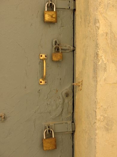 Maltese door. One lock is never enough.. fear of intrusion?cheap solution