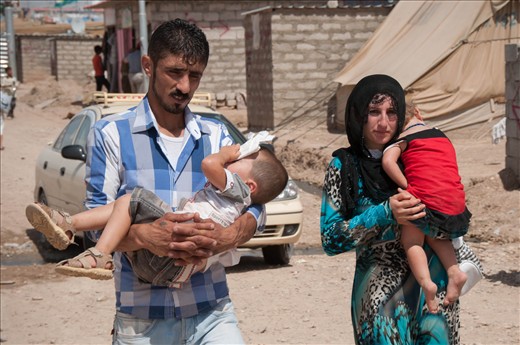 One day of walking divides the Syrian-Iraqi border to the Domiz refugees' camp. Syrian people arriving here after having been travelling for days have nothing to carry but exhausted children and lots of hope in their eyes. Here is a family of refugees just arrived at the Domiz camp, going to finally find a shelter.