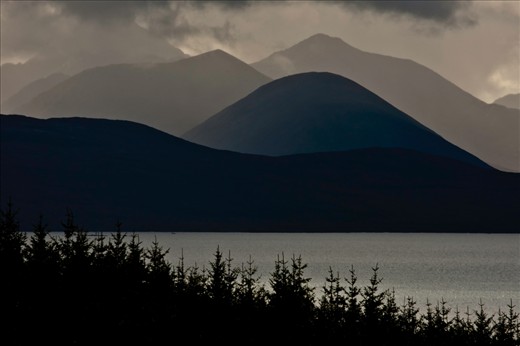 This is a photograph of the Cuillin hills on the Isle of Skye from a hillside above the mains of Applecross. These hills are also a defining view from the place and many hours are taken up by locals and visitors alike, imagining and contemplating while the scene before them constantly changes and is never the same twice.