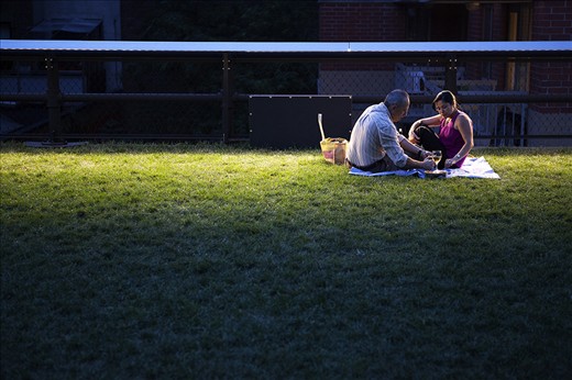 An old couple enjoyed their lovely nightfall on the high line. New York becomes more beautiful when the sun goes down. 