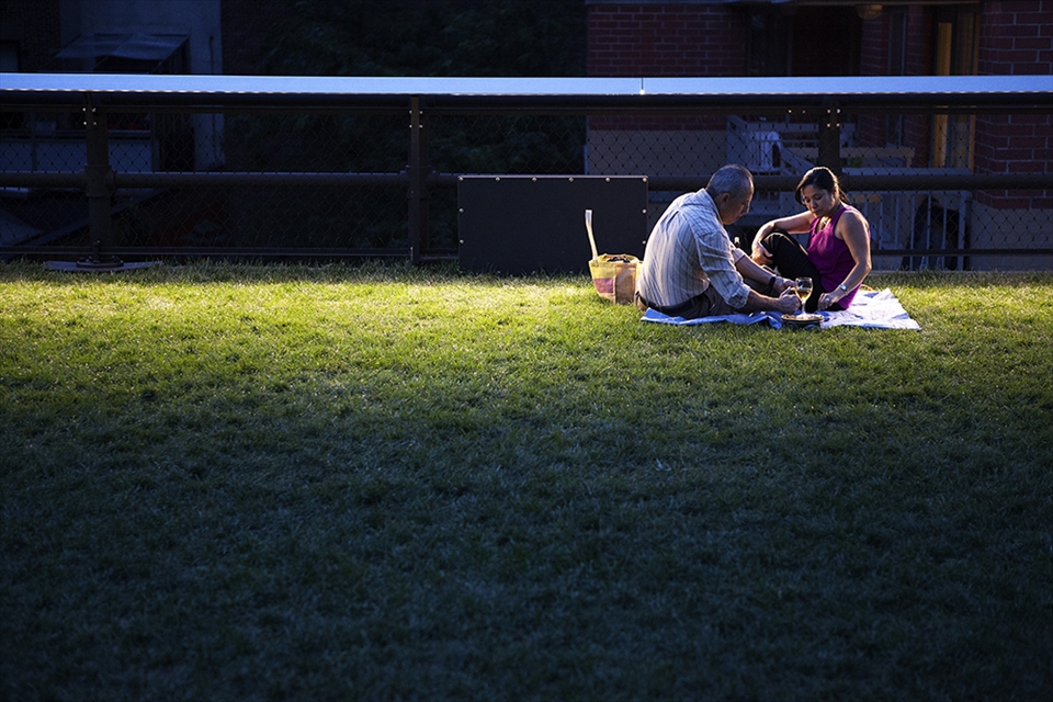 An old couple enjoyed their lovely nightfall on the high line. New York becomes more beautiful when the sun goes down. 