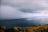 The swirling water intensifies and a funnel begins to form. It's still a 20 minute walk back to the bus, but we can't tear ourselves away from this weather phenomenon.: by ericaannmeyer, Views[138]
