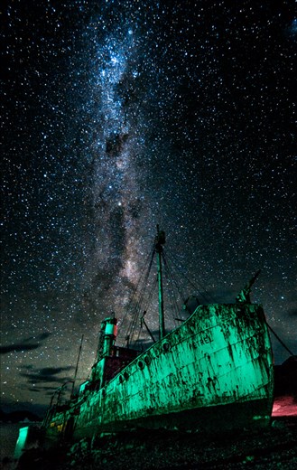 Otherworldly: A derelict whaling boat sits beneath the Antarctic night sky.