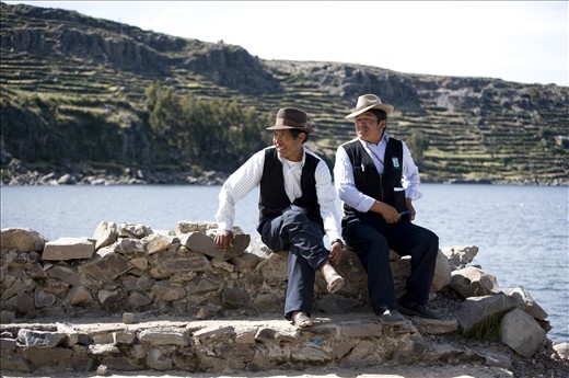 Island  Amantani residents in traditional clothing having a nice visit. 