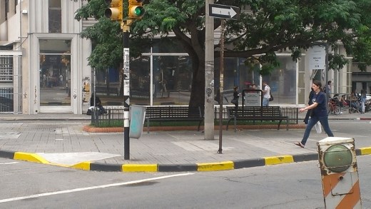 The trash can hanging on that pole is city trash to try to cut down on littering