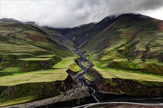 
This article is about the village in Azerbaijan. For the language, see Khinalug language.
Khinalug
Xınalıq
—  Municipality  —



Khinalug
Coordinates: 41°10′41″N 48°07′36″ECoordinates: 41°10′41″N 48°07′36″E
Country	 Azerbaijan
Rayon	Quba
Elevation	2,350 m (7,710 ft)
Population [citation needed]
 • Total	2,075
Time zone	AZT (UTC+4)
 • Summer (DST)	AZT (UTC+5)
Khinalug, Khinalugh, or Khinalig (Azerbaijani: Xınalıq; Khinalug: Kətş; also rendered as Khanaluka, Khanalyk, Khinalykh, or Khynalyk) is an ancient Caucasian village going back to the Caucasian Albanian period. It is located high up in the mountains of Quba Rayon, Azerbaijan. It is also a municipality in Quba Rayon, which consists of the villages of Khinalug and Qalayxudat.[7]
It is located just north of Quba in the middle of the Greater Caucasus mountains that divide Russia and the South Caucasus. Khinalug is also the highest, most remote and isolated village in Azerbaijan and among the highest in the Caucasus. The weather changes dramatically during summer and winter, ranging from −20 °C to 18 °C. Khinalug has a population of about 2,000 people. This small group of people speaks the Khinalug language, which belongs to the Northeast Caucasian language family, although many speak Azerbaijani as well.
Because of its location, scenery and relative isolation, the village is considered one of Azerbaijan's premiere destinations for hikers and adventure travellers in such travel guides as Lonely Planet.
Khinalug
Xınalıq
—  Municipality  —



Khinalug
Coordinates: 41°10′41″N 48°07′36″ECoordinates: 41°10′41″N 48°07′36″E
Country	 Azerbaijan
Rayon	Quba
Elevation	2,350 m (7,710 ft)
Population [citation needed]
 • Total	2,075
Time zone	AZT (UTC+4)
 • Summer (DST)	AZT (UTC+5)
 (Azerbaijani: Xınalıq; Khinalug: Kətş; also rendered as Khanaluka, Khanalyk, Khinalykh, or Khynalyk) is an ancient Caucasian village going back to the Caucasian Albanian period. It is located high up in the mountains of Quba Rayon, Azerbaijan. It is also a municipality in Quba Rayon, which consists of the villages of Khinalug and Qalayxudat.[7]
It is located just north of Quba in the middle of the Greater Caucasus mountains that divide Russia and the South Caucasus. Khinalug is also the highest, most remote and isolated village in Azerbaijan and among the highest in the Caucasus. The weather changes dramatically during summer and winter, ranging from −20 °C to 18 °C. Khinalug has a population of about 2,000 people. This small group of people speaks the Khinalug language, which belongs to the Northeast Caucasian language family, although many speak Azerbaijani as well.
Because of its location, scenery and relative isolation, the village is considered one of Azerbaijan's premiere destinations for hikers and adventure travellers in such travel guides as Lonely Planet.