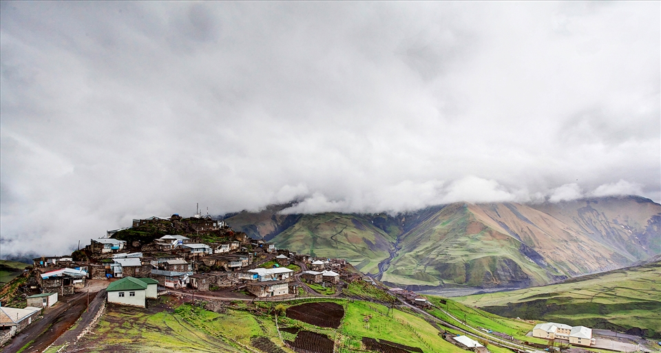 This article is about the village in Azerbaijan. For the language, see Khinalug language.
Khinalug
Xınalıq
—  Municipality  —



Khinalug
Coordinates: 41°10′41″N 48°07′36″ECoordinates: 41°10′41″N 48°07′36″E
Country	 Azerbaijan
Rayon	Quba
Elevation	2,350 m (7,710 ft)
Population [citation needed]
 • Total	2,075
Time zone	AZT (UTC+4)
 • Summer (DST)	AZT (UTC+5)
Khinalug, Khinalugh, or Khinalig (Azerbaijani: Xınalıq; Khinalug: Kətş; also rendered as Khanaluka, Khanalyk, Khinalykh, or Khynalyk) is an ancient Caucasian village going back to the Caucasian Albanian period. It is located high up in the mountains of Quba Rayon, Azerbaijan. It is also a municipality in Quba Rayon, which consists of the villages of Khinalug and Qalayxudat.[7]
It is located just north of Quba in the middle of the Greater Caucasus mountains that divide Russia and the South Caucasus. Khinalug is also the highest, most remote and isolated village in Azerbaijan and among the highest in the Caucasus. The weather changes dramatically during summer and winter, ranging from −20 °C to 18 °C. Khinalug has a population of about 2,000 people. This small group of people speaks the Khinalug language, which belongs to the Northeast Caucasian language family, although many speak Azerbaijani as well.
Because of its location, scenery and relative isolation, the village is considered one of Azerbaijan's premiere destinations for hikers and adventure travellers in such travel guides as Lonely Planet.
Khinalug
Xınalıq
—  Municipality  —



Khinalug
Coordinates: 41°10′41″N 48°07′36″ECoordinates: 41°10′41″N 48°07′36″E
Country	 Azerbaijan
Rayon	Quba
Elevation	2,350 m (7,710 ft)
Population [citation needed]
 • Total	2,075
Time zone	AZT (UTC+4)
 • Summer (DST)	AZT (UTC+5)
 (Azerbaijani: Xınalıq; Khinalug: Kətş; also rendered as Khanaluka, Khanalyk, Khinalykh, or Khynalyk) is an ancient Caucasian village going back to the Caucasian Albanian period. It is located high up in the mountains of Quba Rayon, Azerbaijan. It is also a municipality in Quba Rayon, which consists of the villages of Khinalug and Qalayxudat.[7]
It is located just north of Quba in the middle of the Greater Caucasus mountains that divide Russia and the South Caucasus. Khinalug is also the highest, most remote and isolated village in Azerbaijan and among the highest in the Caucasus. The weather changes dramatically during summer and winter, ranging from −20 °C to 18 °C. Khinalug has a population of about 2,000 people. This small group of people speaks the Khinalug language, which belongs to the Northeast Caucasian language family, although many speak Azerbaijani as well.
Because of its location, scenery and relative isolation, the village is considered one of Azerbaijan's premiere destinations for hikers and adventure travellers in such travel guides as Lonely Planet.