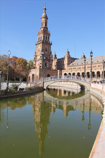 Plaza de España known in English as Spain Square, is one of the famous sights in Seville. It is located in Maria Luisa Park and was designed by Anibal Gonzalez. It is a good example of the Rennaisance Revival Style in Spanish Architecture. It is the site of the Spanish pavilion from the 1929 exhibition.

Don't miss walking around the area and if you have enough time, take a walk in Maria Luisa Park is also a good  chance to relax and enjoy its landscape. There are also attractive monuments and museums for you to discover.