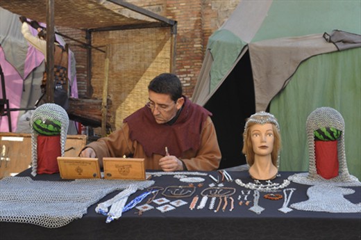 Chain mail maker at work in the fair