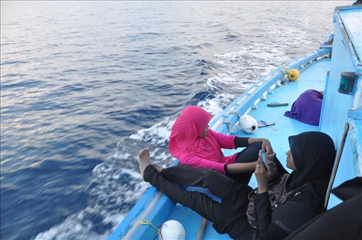 Long dhoni rides can also be boring and local teens need to keep up with friends