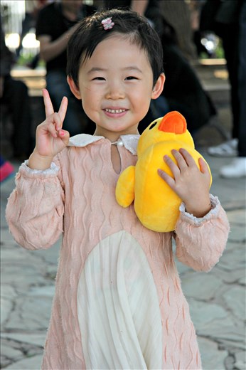 A cute Chinese girl posing like a professional model at the Summer Palace, Beijing.