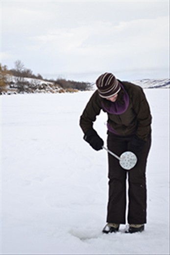Scooping slush from the hole prevents it from freezing over at - 18 C