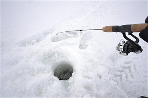 The view every ice fisher contemplates:  Slushy darkness and a submerged rod!