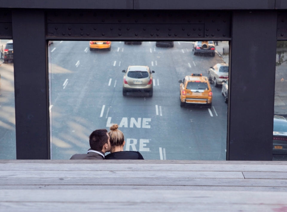 A couple finds a hideaway on the Highline Park in New York City.  They watch life go by fast but hold on to the love they have for each other.  