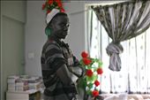 Joel Okumu, standing confidently in living area of family home.: by eyeofthebeholder, Views[329]