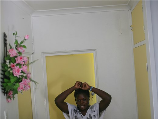 Benta Okumu fooling around at family home. 