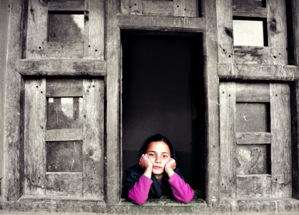 aaisha, staring out her kitchen window after a long day at school