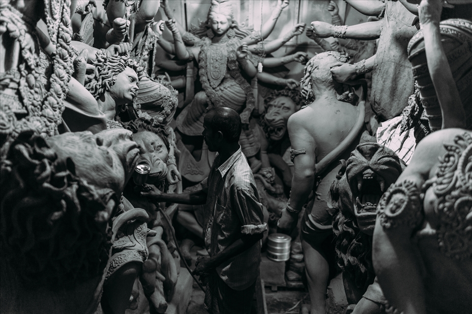 In God's Image - Layers of this clay are added to wooden frames, built to support several deities in standard poses, normally representing popular episodes from the epics. The attention to detail required of these artists means that this is tedious work and though the festival itself lasts only a week, the work goes on throughout the year.