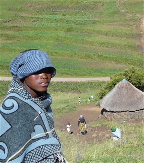 Teboho, a young herdsman from the same village as Makalo, is wrapped in the traditional Basotho blanket. He is the eldest grandchild and the family breadwinner. He begins his day leaving his siblings, their grandmother, who is their sole caretaker and the little hut they all share behind. 