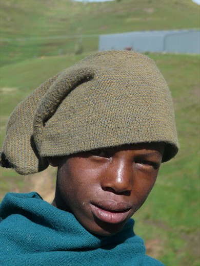 Makalo, a young herdsman from Semonkong, Lesotho. He began herding when he was 7 years old. Young boys who are trained to become herdsman begin their training around age six instead of attending school in order to support their families. These young boys lose their chance at an education and the socialization of a normal childhood.