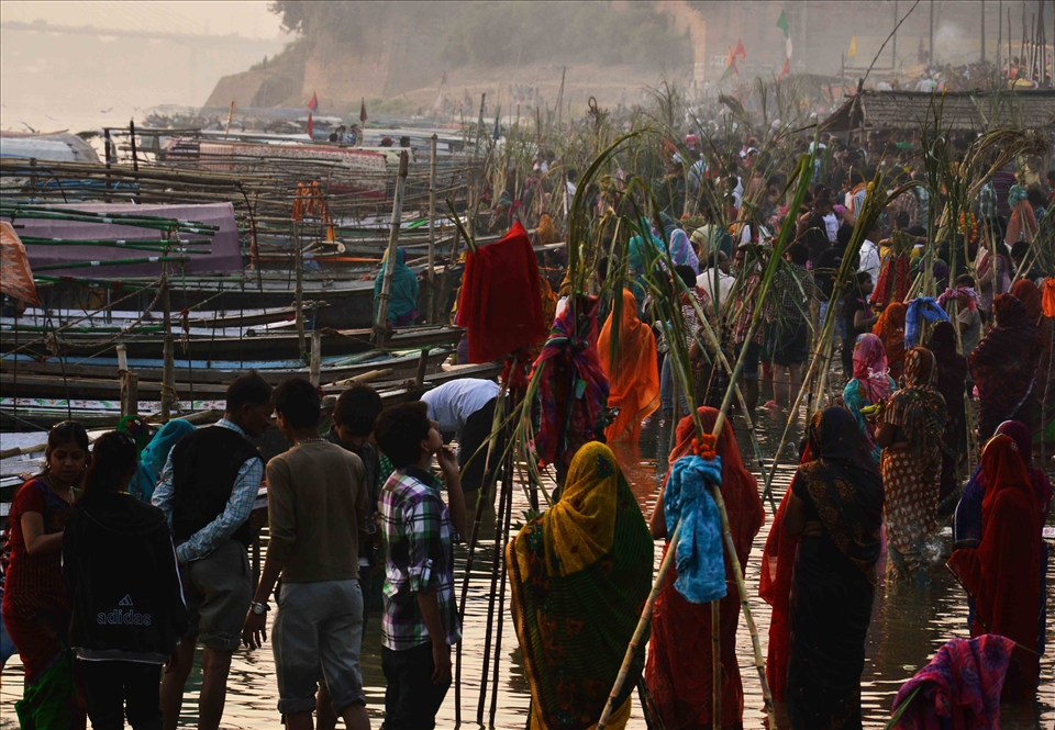 The first day of Chhath Puja, the devotees take a dip,in the river Ganges.