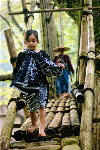 The little girl bring basket to the field. Kids in that village doesn’t school