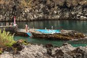 Pool carved in the rocks near the village „Caloura“ -Picture 6451- 

Azoreans enjoy life. They are having siestas, take baths in hot springs or a swimming pool right in the rocks. They keep things real and natural.: by fastimage, Views[1925]