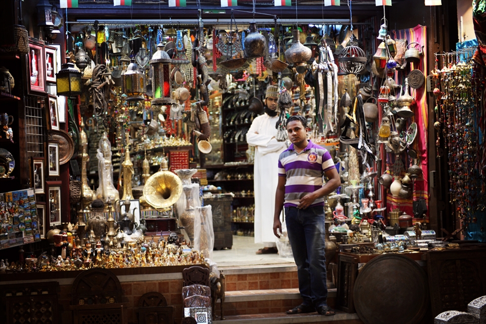 Men in front of their shop in the souq of Muttrah. 
