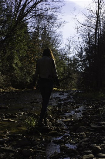Illustrator Mairin-Taj Caya, hopping stones in Kenneglenn Nature Preserve.