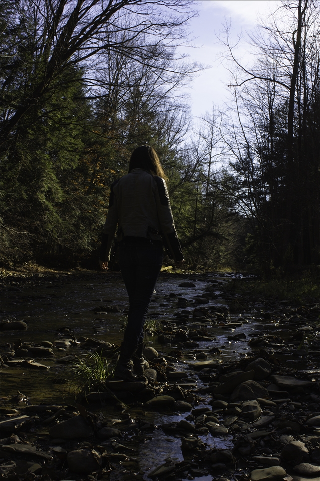 Illustrator Mairin-Taj Caya, hopping stones in Kenneglenn Nature Preserve.