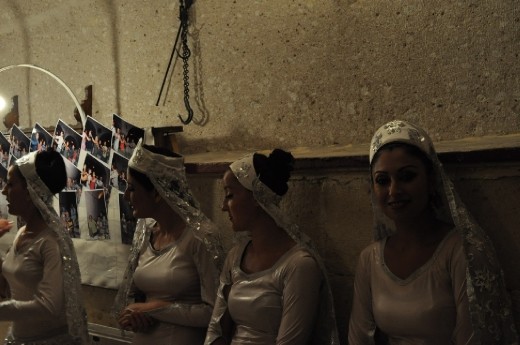 ready to go to play a typical Turkish dancing girl smiles and looks towards the camera, in one of the hundreds of caves in the  Cappadocia´ valley