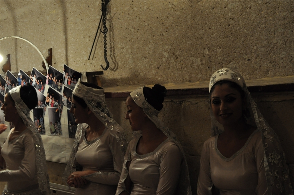 ready to go to play a typical Turkish dancing girl smiles and looks towards the camera, in one of the hundreds of caves in the  Cappadocia´ valley