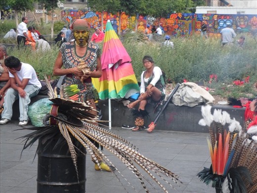 A 'conchero' dancer is getting prepared for the ceremony he is about to perform. It is common to see street artists doing rituals based on Pre-Columbian beliefs outside the ruins of Templo Mayor.