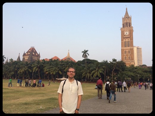 Mumbai. Kurt in front of a cricket field and one of many beautiful Victorian style architecture buildings. It's like London ... except  it's 45 degrees!