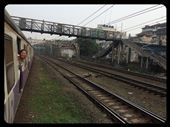 Riding the suburban local train in Mumbai again. For 15 cents you can ride the rails! Most people hang out the windows for fresh air. They don't have a subway in Mumbai (btw, it's the biggest city in India with 20 million people) so millions take trains everyday. Be careful and don't miss your stop, normally you should jump off before otherwise the train is swarmed with dozens of sweaty men all jumping in for a spot. :-(: by finally, Views[669]