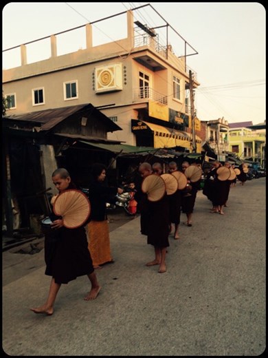 Hungry Buddhist monks lining up for rice at 6.30 am. They don't have dinner for religious reasons so they are rather hungry in the morning. 