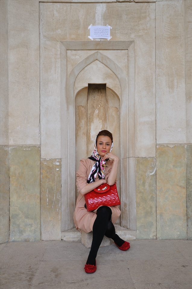 During my three weeks in Iran, I am fascinated by the women. They come in all colours of clothing, black being the most common. Women from a country town dress conservatively, while their city counterparts prefer vibrant colours. 

I saw this woman at the Afif-Abad Garden in Shiraz. She was stunningly beautiful and I approached her for a photograph.

I couldn’t learn more about her as language was a barrier. She was the most fashionable woman I saw. A modern side to Iran.