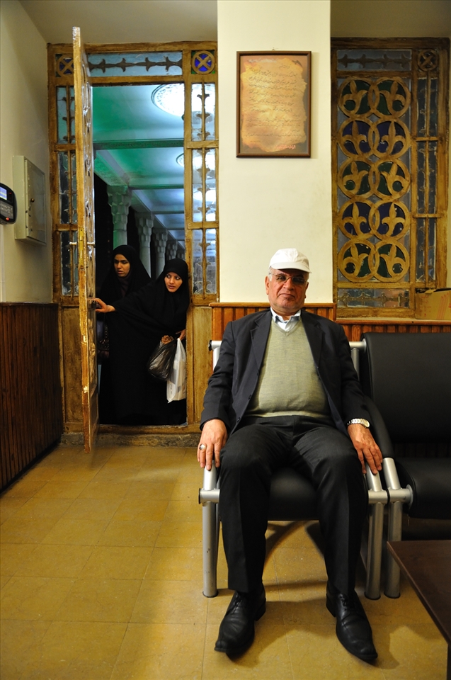 Next to the Koran, the most revered book in Iran is possibly, the collection of poems written by Hafez. Not only is this book a literary masterpiece, it can also divine one’s fortunes.

 At the Tomb of Hafez in Shiraz, I was greeted by the Director and a member of his staff. They invited me for tea, which I accepted. I joined them in their office, listened to the sounds of conversation. People came in and out to borrow (or return) one of many books on the Director’s desk. 

I photograph the staff member just when two women opened the door. They came to borrow a book of Hafez’s poems.
