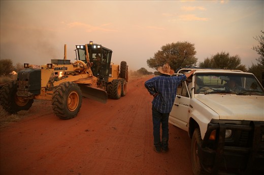 The Bullo Shire's grader provides much needed suport to help with back burning. Graders are needed to cut fire brakes on the outside of the fire to allow back burning. This fire was about 22km in circumference 