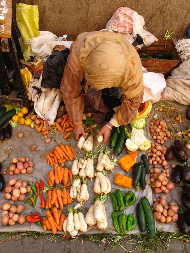 Along the medina walls are lined with locally grown produce from the atlas region. The woman lays out her bunches of vegetable to sell in the morning hours. If all goes well she will have earned enough to provide for her family. My experiences capture images that investigate the social and environmental transformations occurring in Morocco.