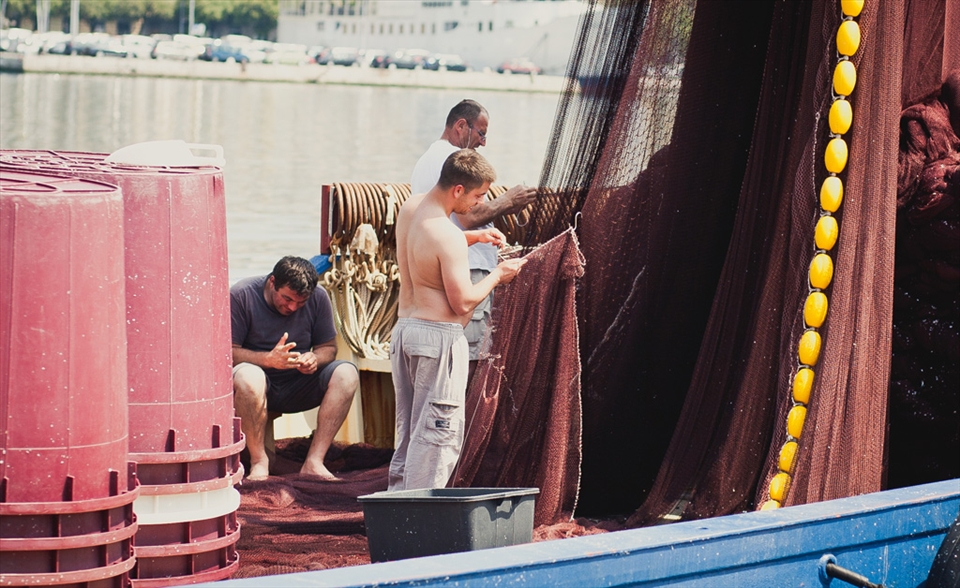 Fishermen in harbor of Rijeka aren’t strange to see. Depending on the weather, you can always see a trawler coming back to harbour or going to the see in search for some seafood to feed family or maybe to sell it on the market nearby. Here are three men which are checking their nets on a sunny day.