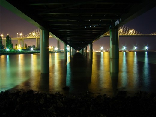 Still another view of Vasco da Gama Bridge taken from under this river Tagus passage during low tide. It was about 11pm, there was noone around and I had the place to myself to completly absorb it.
